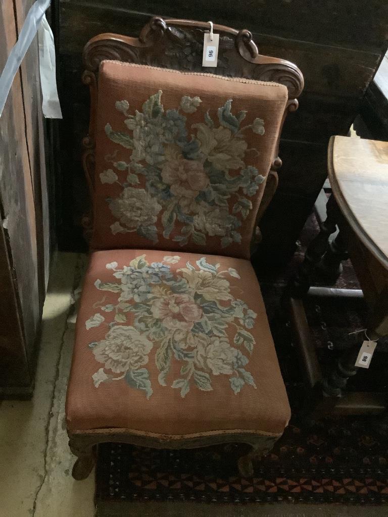 A Victorian carved walnut sewing chair, width 50cm, depth 60cm, height 95cm